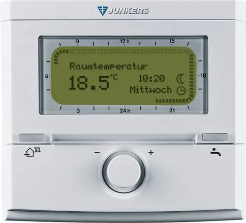 Thermostat von Bosch mit digitalem Display, zeigt die aktuelle Raumtemperatur von 18.5°C, Uhrzeit und Wochentag an. Bedienelemente sind unterhalb des Displays angeordnet.